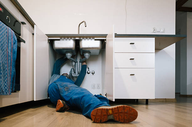 Professional Emergency Plumber technician working in Amston, CT